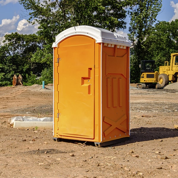 what is the cost difference between standard and deluxe portable toilet rentals in Clayton